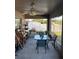 Cozy screened-in lanai with fan and plants, perfect for enjoying the outdoors at 1381 Woodlark Dr, Haines City, FL 33844