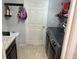 Modern laundry room boasts updated appliances and ample storage space, ready for use at 1381 Woodlark Dr, Haines City, FL 33844
