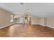 Spacious bonus room features wood flooring, natural light, and access to bathroom at 1544 Hunters Mill Pl, Oviedo, FL 32765
