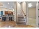Staircase and entry area featuring hardwood floors and a light wood banister at 1544 Hunters Mill Pl, Oviedo, FL 32765