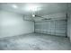 Spacious garage with cement block walls, overhead light, and an automatic door opener at 160 Fisher Loop, Ocklawaha, FL 32179