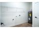 Laundry room with water heater, shelving, and new construction connections at 160 Fisher Loop, Ocklawaha, FL 32179