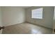 Bedroom with tile floor, window, and closet at 1651 W Oak Ridge Rd # 1651A, Orlando, FL 32809