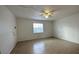 Living room featuring tile floor, ceiling fan and a window at 1651 W Oak Ridge Rd # 1651A, Orlando, FL 32809
