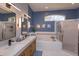 Updated bathroom features dual sinks, a soaking tub, and a separate shower with a glass enclosure at 1701 Knotting Hill Dr, Orlando, FL 32835