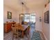 Comfortable dining room featuring wood floors, and natural light from sliding glass door at 1701 Knotting Hill Dr, Orlando, FL 32835