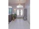 Bright entryway featuring tiled floors, decorative doors, and stylish furnishings at 1701 Knotting Hill Dr, Orlando, FL 32835