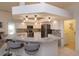 Contemporary kitchen featuring white cabinets, granite countertops, and a convenient breakfast bar at 1701 Knotting Hill Dr, Orlando, FL 32835
