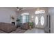 Cozy living room featuring a fireplace, elegant decor, and ample natural light at 1701 Knotting Hill Dr, Orlando, FL 32835