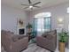 Comfortable living room with neutral tones, fireplace, and a large window at 1701 Knotting Hill Dr, Orlando, FL 32835