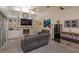 Vaulted ceilings and neutral colors create a cozy living room with built-in shelving and fireplace at 1701 Knotting Hill Dr, Orlando, FL 32835