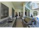 Outdoor kitchen features stainless steel appliances, granite countertops, and a built-in grill, perfect for entertaining at 1701 Knotting Hill Dr, Orlando, FL 32835