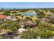 Stunning aerial view of the house overlooking a golf course and lake in the distance at 1723 Lee Janzen Dr, Kissimmee, FL 34744