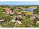 Aerial view of waterfront community with golf course and mature landscaping at 1723 Lee Janzen Dr, Kissimmee, FL 34744