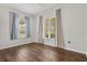 Sun-filled bedroom with hardwood floors, and dual windows with views at 1723 Lee Janzen Dr, Kissimmee, FL 34744