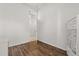 Empty bedroom with ensuite bath, closet, and hardwood floors at 1723 Lee Janzen Dr, Kissimmee, FL 34744