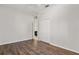Empty bedroom with closet, ensuite bath, and hardwood floors at 1723 Lee Janzen Dr, Kissimmee, FL 34744