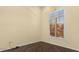 Minimalist bedroom with hardwood floors and natural light from large window at 1723 Lee Janzen Dr, Kissimmee, FL 34744