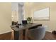 Home office with a modern desk and a neutral color scheme, offering a calm workspace at 1723 Lee Janzen Dr, Kissimmee, FL 34744