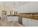 Updated kitchen featuring granite countertops, stainless steel appliances, and eat-in area at 1723 Lee Janzen Dr, Kissimmee, FL 34744