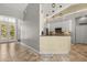 Open kitchen layout with white cabinets and granite countertops; perfect for entertaining at 1723 Lee Janzen Dr, Kissimmee, FL 34744