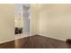 Spacious living room with dark wood floors leading to dining area with decorative tiled floors at 1723 Lee Janzen Dr, Kissimmee, FL 34744