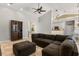 Comfortable living room with a sectional sofa, wine rack and open access to kitchen area at 1723 Lee Janzen Dr, Kissimmee, FL 34744