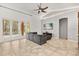 Bright living room with access to the outdoor pool area through glass doors at 1723 Lee Janzen Dr, Kissimmee, FL 34744