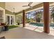 Screened in patio with ceiling fans and a view of a pool area with tropical landscaping at 1723 Lee Janzen Dr, Kissimmee, FL 34744