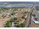 Aerial showcasing the property's location relative to a nearby neighborhood, railroad tracks, and green spaces at 2300 Olsen Rd, Haines City, FL 33844
