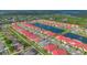 An impressive aerial view of a community with lush landscaping and a serene lake at 2335 Symphony Cir, St Cloud, FL 34771