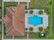 Aerial view showcases the backyard oasis with pool, lounging, patio, and palm trees at 2335 Symphony Cir, St Cloud, FL 34771