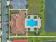 Bird's eye view of a backyard pool area, complete with a patio, lounge chairs and palm trees at 2335 Symphony Cir, St Cloud, FL 34771