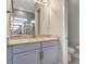 Bathroom vanity with granite countertops and double mirrors at 2335 Symphony Cir, St Cloud, FL 34771