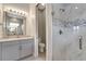 Bathroom featuring granite countertops and a glass shower at 2335 Symphony Cir, St Cloud, FL 34771
