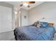 Comfortable bedroom with neutral walls, ceiling fan, carpet flooring, and access to ensuite bathroom at 2335 Symphony Cir, St Cloud, FL 34771