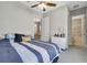 Comfortable bedroom featuring a ceiling fan, neutral paint, and ensuite bathroom at 2335 Symphony Cir, St Cloud, FL 34771