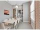 Elegant dining room featuring a modern chandelier, large window, and neutral color scheme at 2335 Symphony Cir, St Cloud, FL 34771