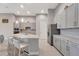 Spacious kitchen island with seating, stainless steel appliances, and stylish gray cabinets at 2335 Symphony Cir, St Cloud, FL 34771