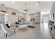 Spacious open concept living area with sleek tile flooring, modern furniture, and ample natural light at 2335 Symphony Cir, St Cloud, FL 34771