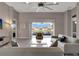 Bright living room showcasing sliding glass doors to the lanai and tranquil backyard views at 2335 Symphony Cir, St Cloud, FL 34771