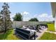 This welcoming backyard boasts a firepit area and comfortable seating, perfect for relaxation and outdoor entertaining at 2547 Great Heron Ave, St Cloud, FL 34773