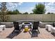 This backyard's inviting firepit area features comfortable seating and hardscape for outdoor enjoyment and entertaining at 2547 Great Heron Ave, St Cloud, FL 34773