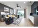Bright living room with comfortable seating, stylish decor, and a sliding glass door to the patio at 2547 Great Heron Ave, St Cloud, FL 34773