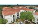 Exterior view of apartments with pool and lush green landscape at 2549 Maitland Crossing Way # 306, Orlando, FL 32810