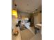 Well-equipped kitchen featuring modern appliances, ample counter space, and stylish pendant lighting at 2549 Maitland Crossing Way # 306, Orlando, FL 32810