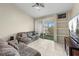 The living room has tile floors and sliding door access to the balcony at 2549 Maitland Crossing Way # 306, Orlando, FL 32810