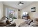 View of the living room with a ceiling fan and tile floors at 2549 Maitland Crossing Way # 306, Orlando, FL 32810