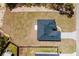 The aerial view captures a new construction home featuring a dark roof and ample lawn space at 2596 Sw 146 St, Ocala, FL 34473