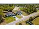 Aerial view of the home showcasing yard, proximity to neighbors and surrounding foliage at 2596 Sw 146 St, Ocala, FL 34473